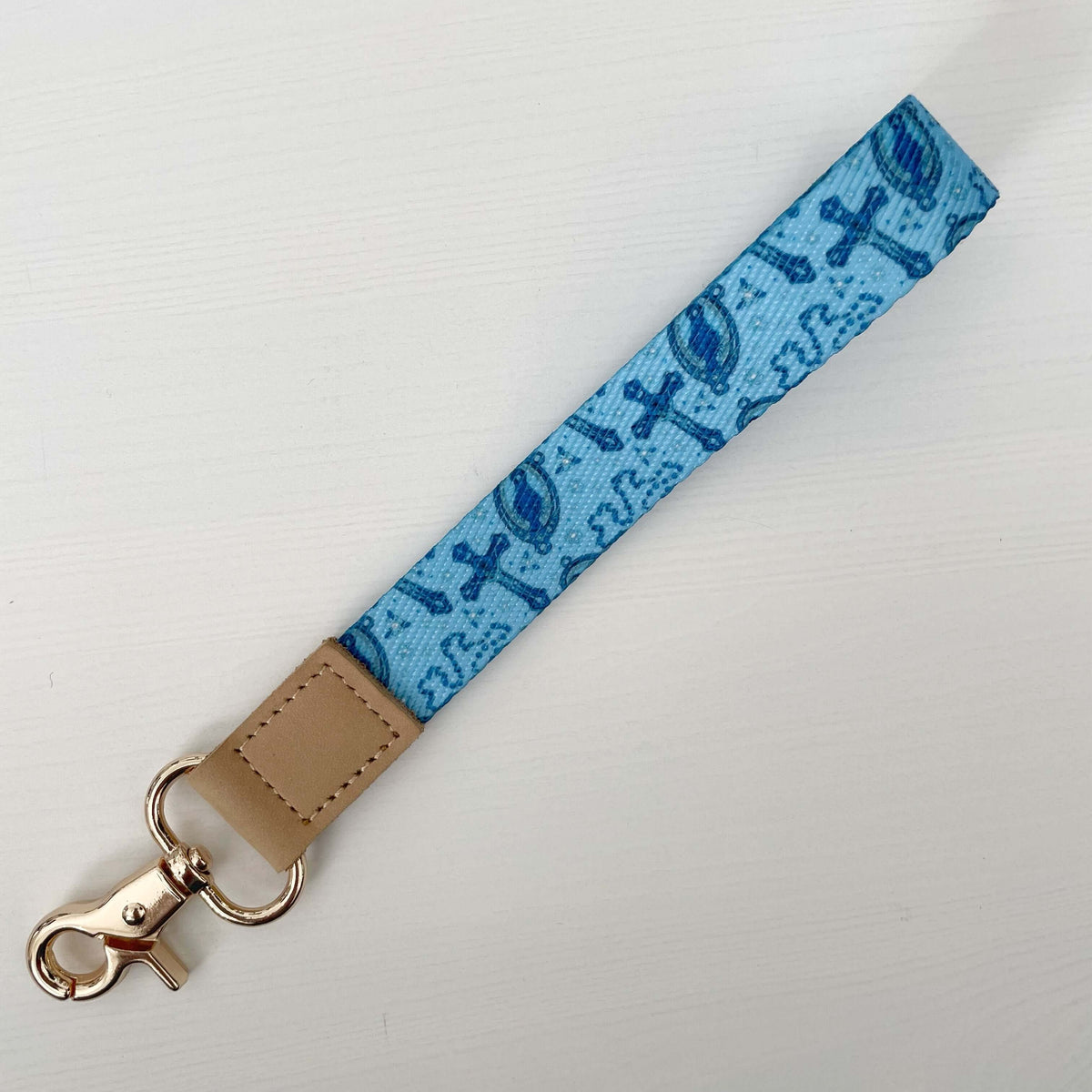 Blue Catholic lanyard from Rosary Collection with cross design and gold clasp, perfect for faith-inspired functionality.