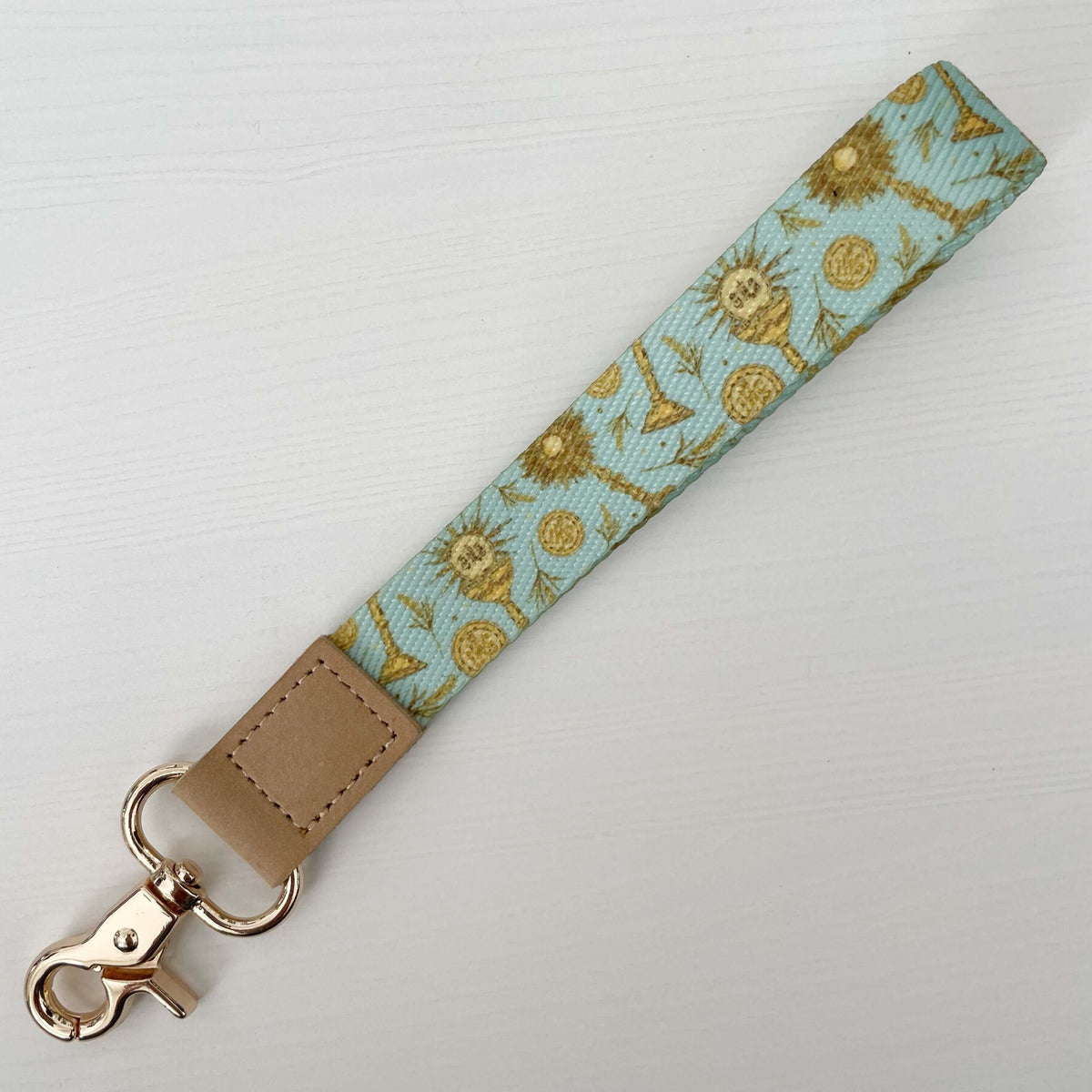 Catholic Eucharistic wrist lanyard with sacred artwork and serene blue design, perfect blend of faith and function for daily use.