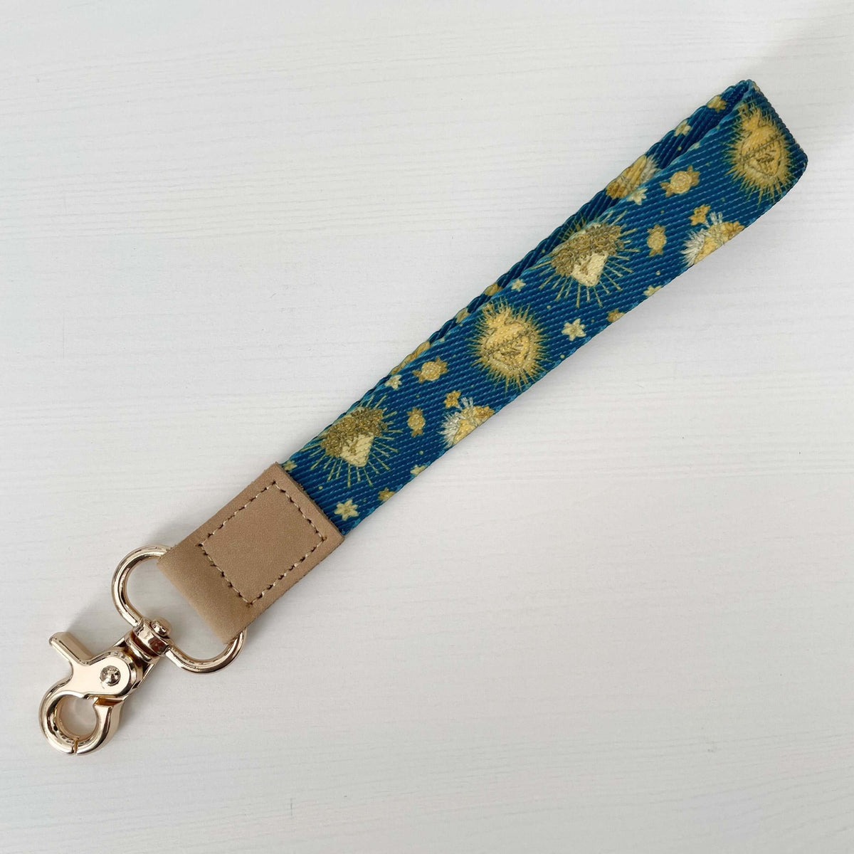 Catholic lanyard from Holy Hearts Collection featuring blue and gold sacred patterns, ideal for daily use and spiritual reminder.