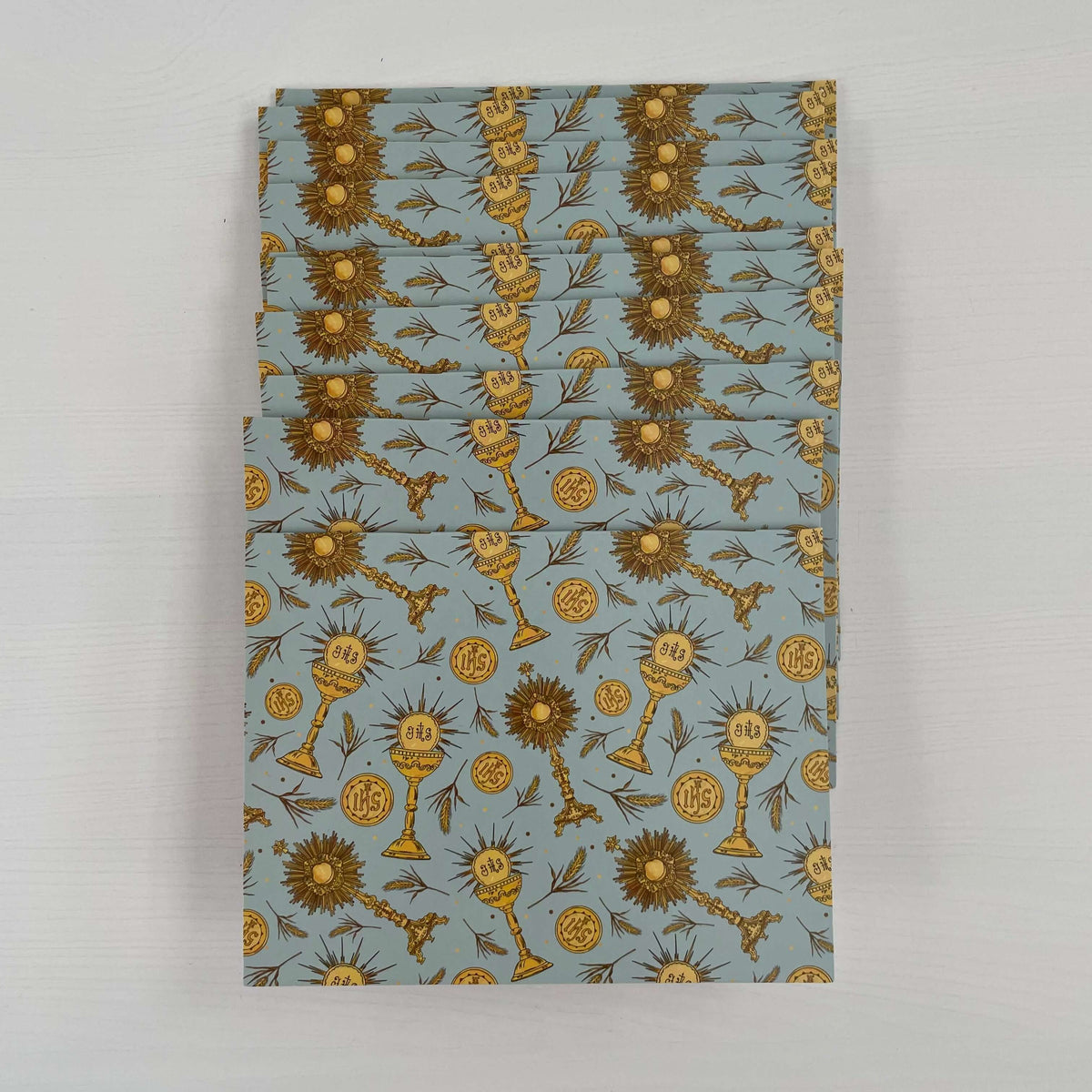 Eucharistic Collection Catholic Note Cards Pack of 10 featuring gold religious symbols on a blue background.