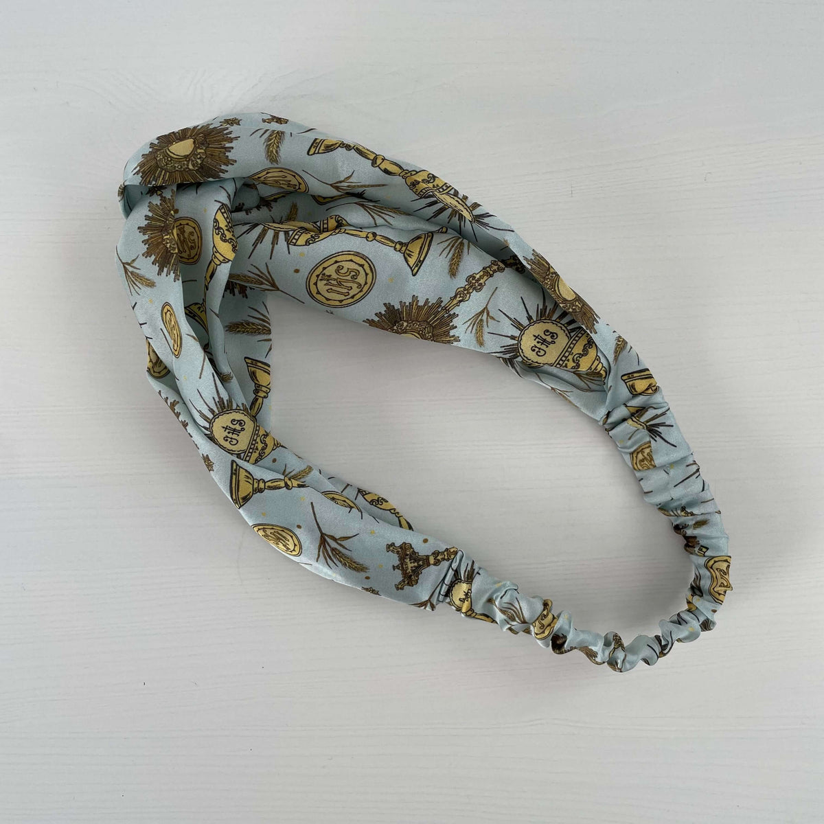Eucharistic Collection Catholic satin headband with divine patterns, combining faith and fashion.