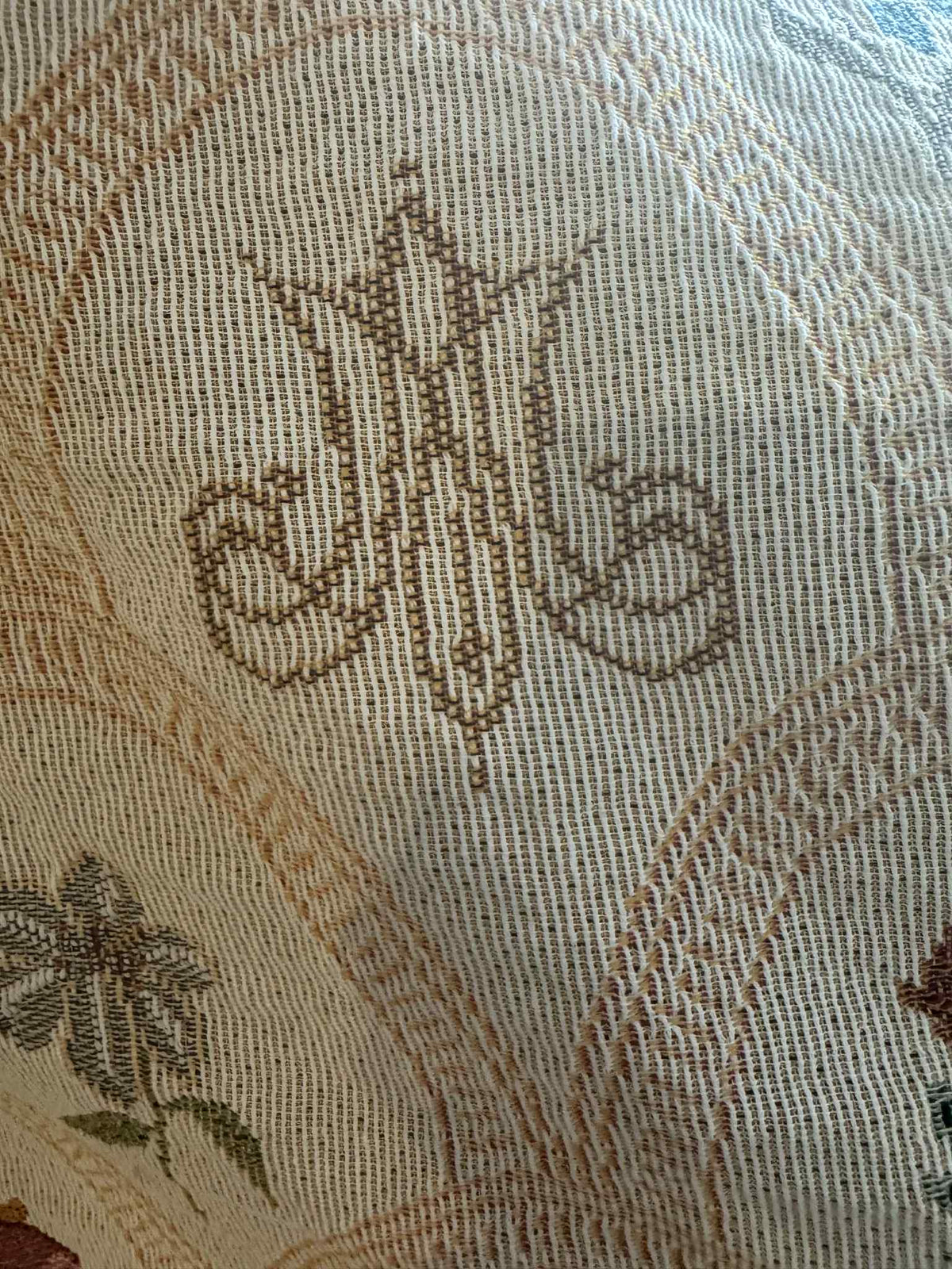 Close-up of Mary's Sacred Garden Woven Blanket showing intricate floral and Marian symbol design, capturing peace and devotion.