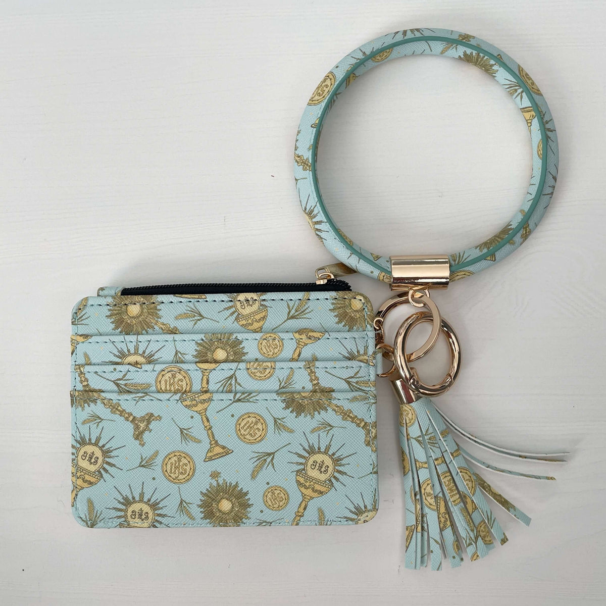 Eucharistic collection ID wallet in blue floral pattern with tassel keyring, combining style and faith for everyday use.