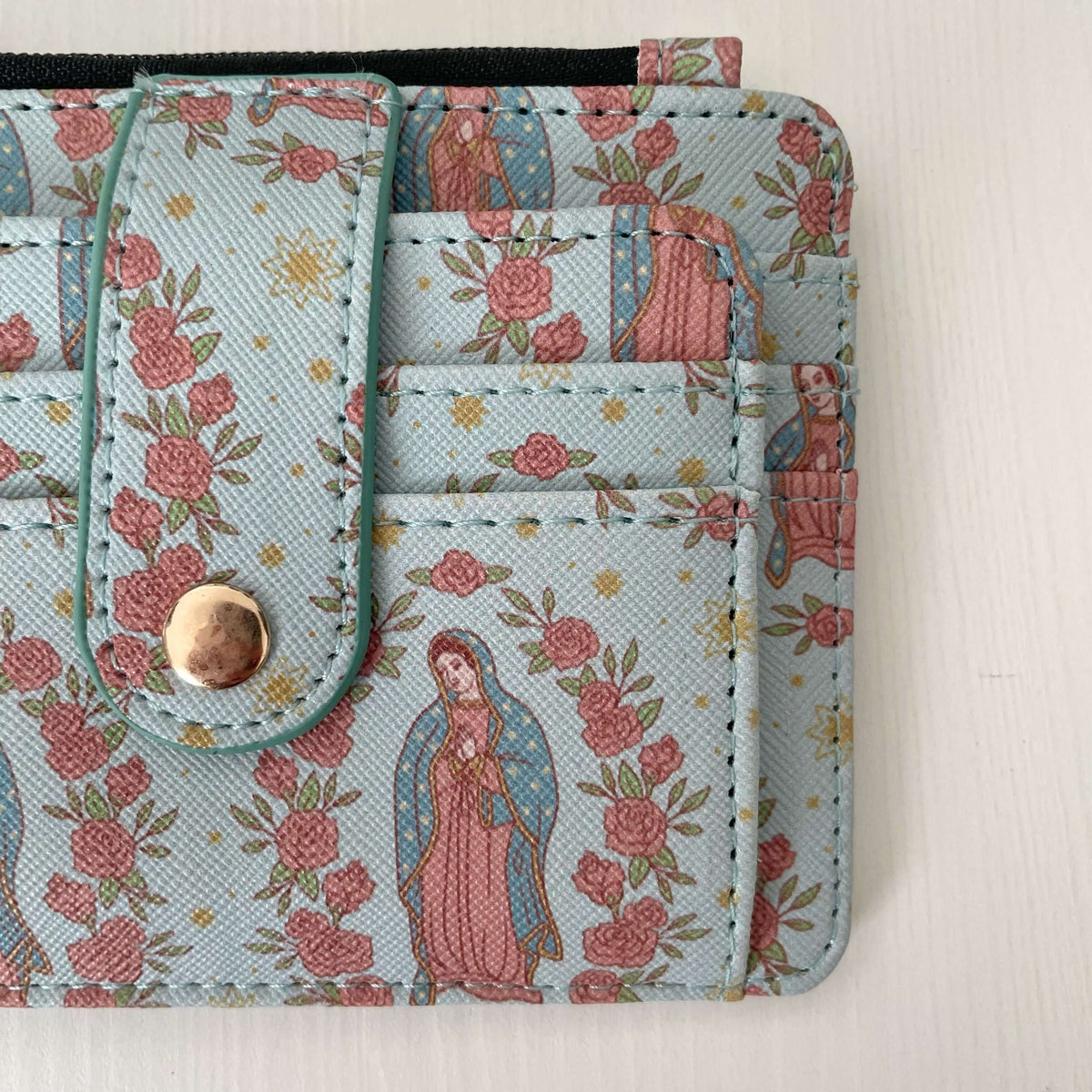 Catholic I.D. Wallet with Guadalupe pattern, durable faux leather, available for $25, part of the Guadalupe Collection.