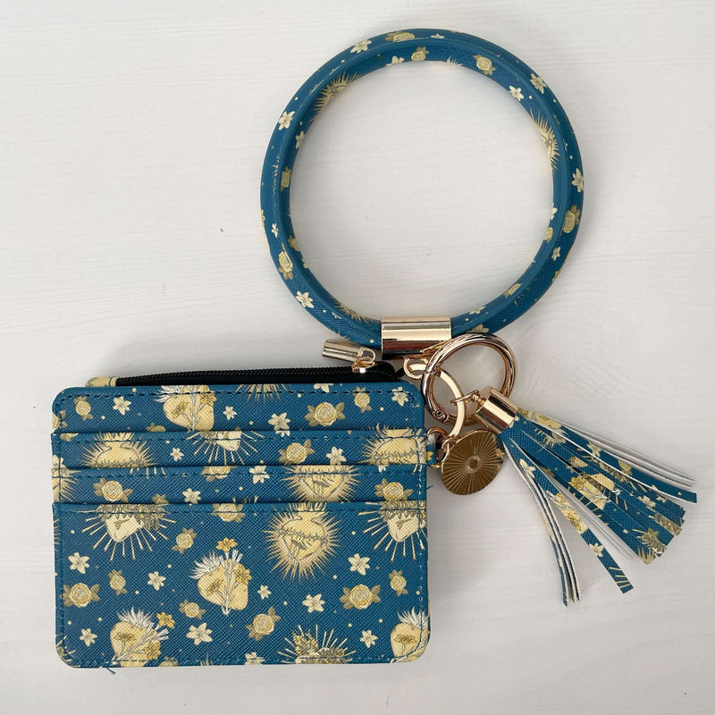 Catholic I.D. Wallet from Holy Hearts Collection, featuring faux leather and golden pattern with wrist strap and tassel.