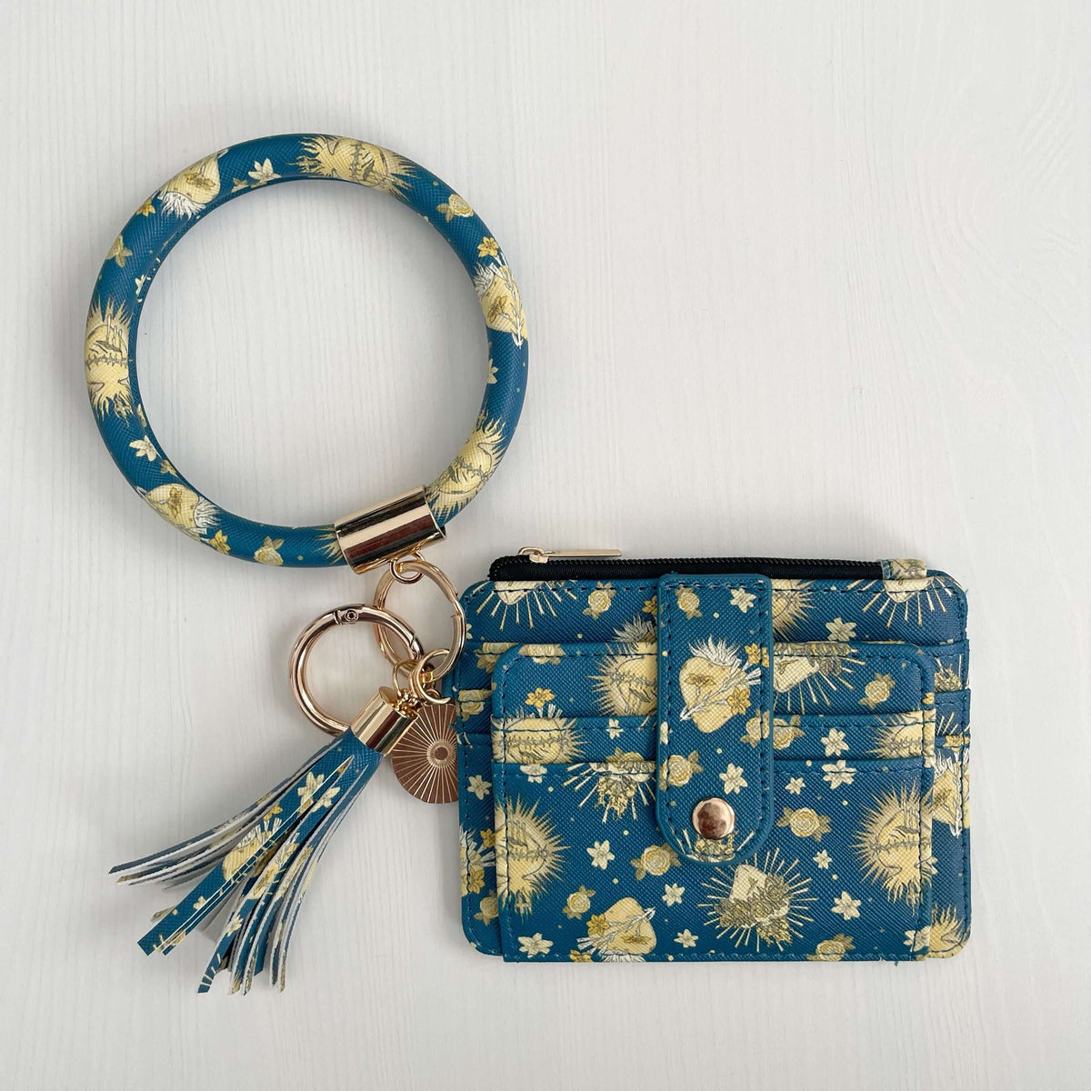 Holy Hearts Collection Catholic ID Wallet with wristlet, blue with golden floral print, made from durable faux leather.