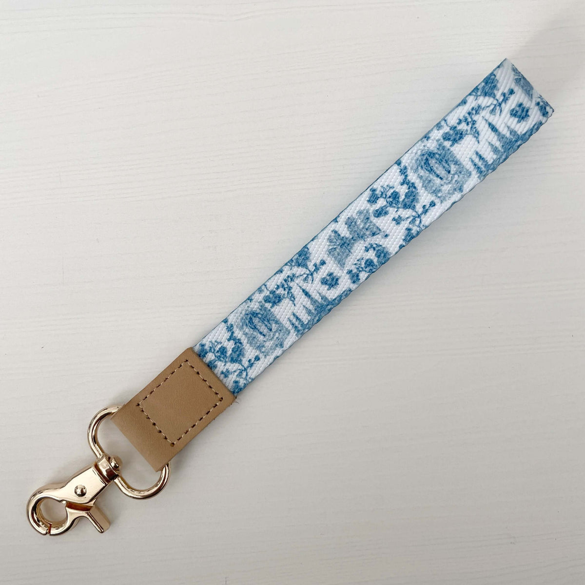 Catholic wrist lanyard from the Lourdes Collection featuring serene blue tones and a durable clasp, perfect blend of faith and function.