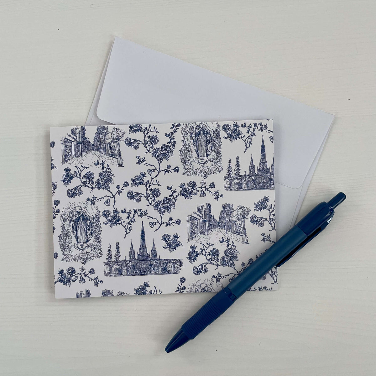 Handwritten Catholic note card with divine Lourdes design and envelope.