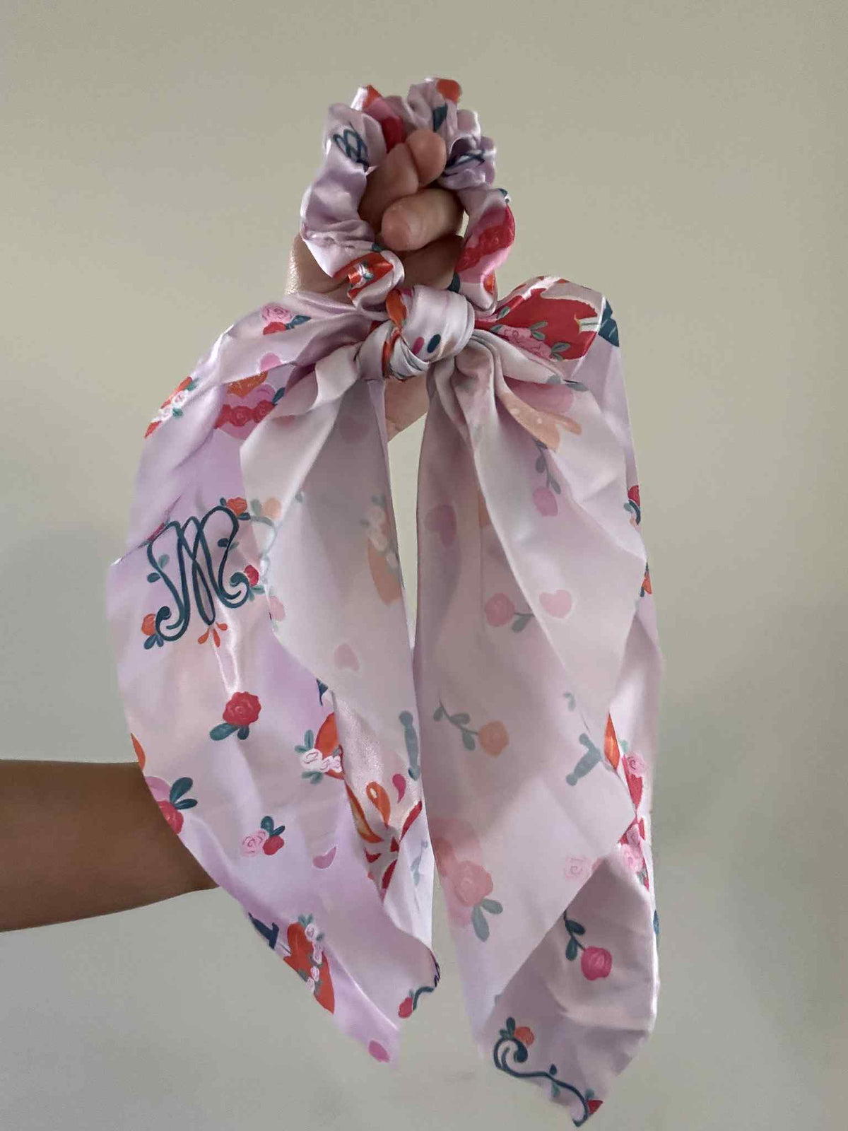 Catholic satin hanging scrunchie with floral pattern from Auspice Maria Collection, featuring a feminine ribbon design.