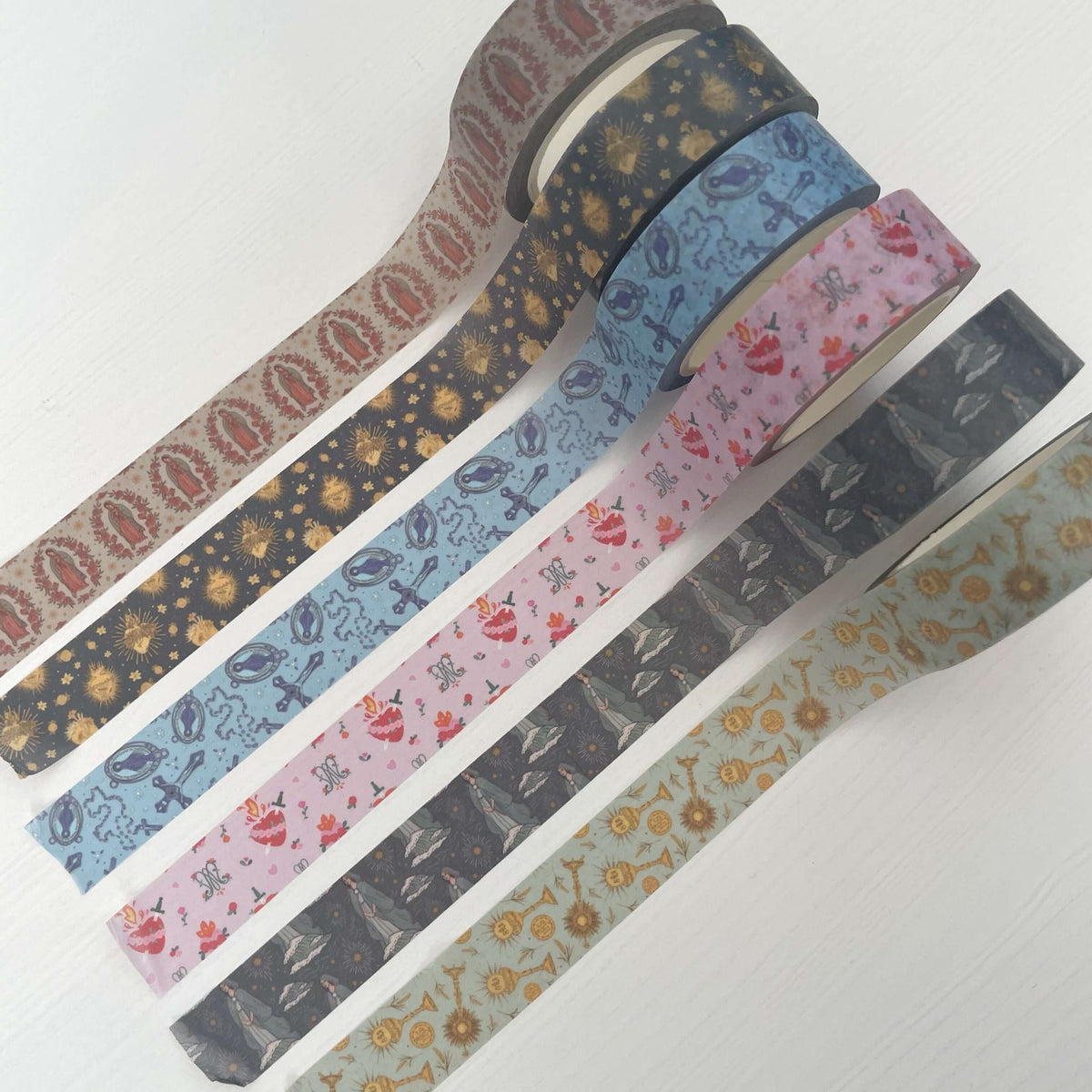Set of 6 Catholic themed washi tapes featuring Guadalupe, Stella, Rosary, Holy Hearts, Auspice Maria, and Eucharistic designs.