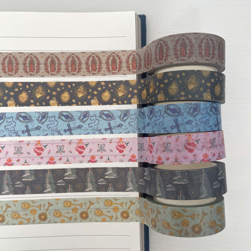 Image of Catholic Washi Tape Set featuring designs like Guadalupe, Stella, Rosary, Holy Hearts, Auspice Maria, and Eucharistic.