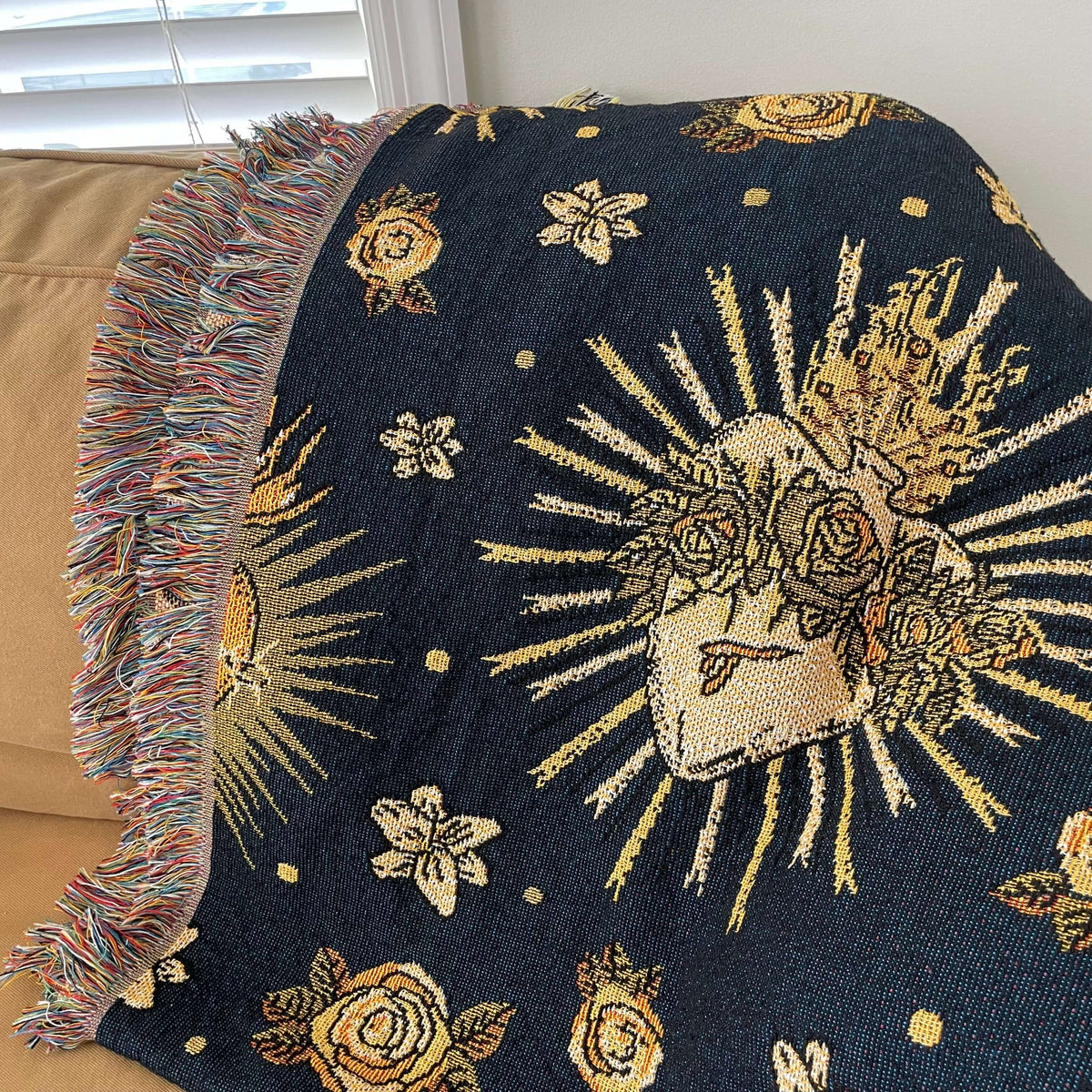 Holy Hearts Woven Blanket featuring Catholic sacred heart pattern on a couch.