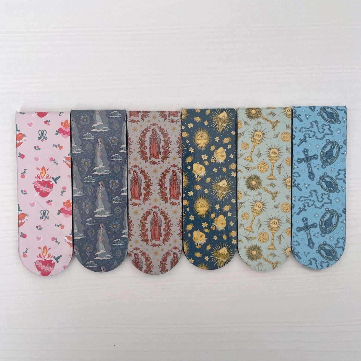 Six Catholic magnetic bookmarks with floral and religious patterns, made from high-quality paper and soft magnets, 2cm x 6cm.