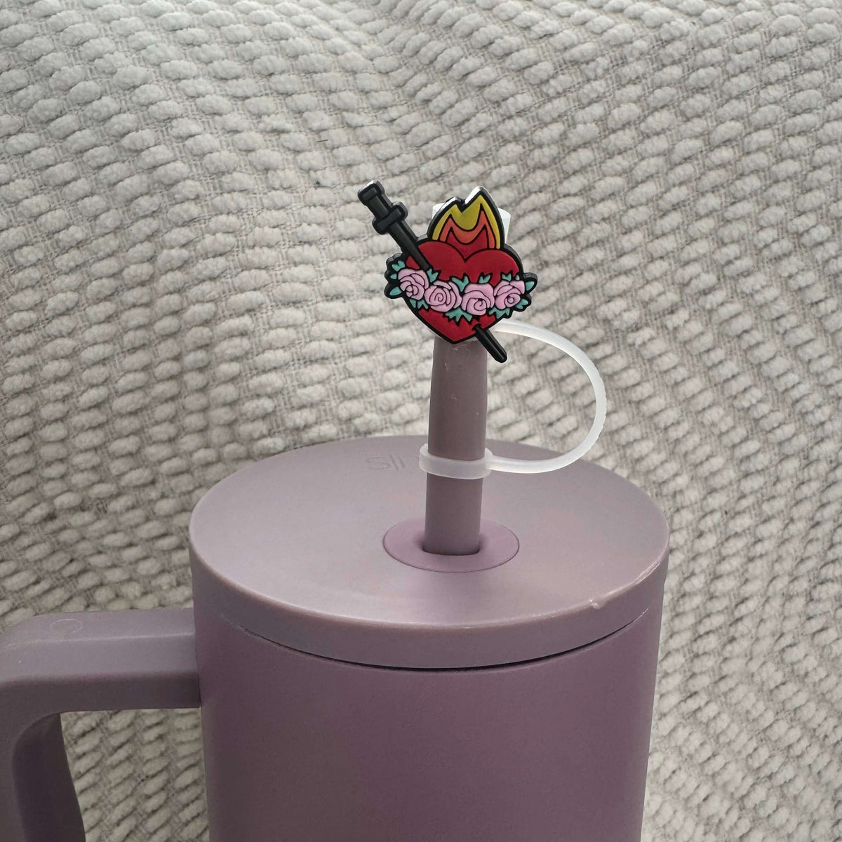 Sacred Heart Catholic straw topper on a purple tumbler, part of a faith-inspired set. Perfect religious gift and daily reminder.