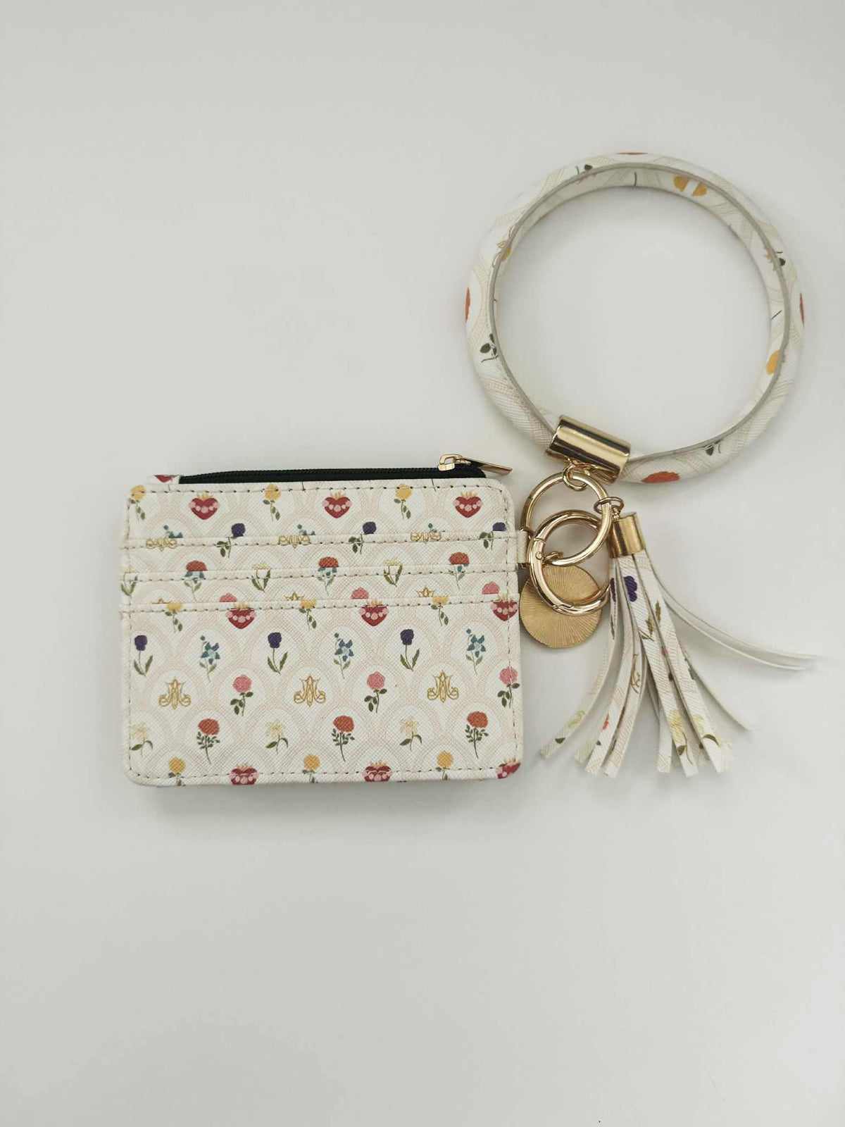 Catholic I.D. Wallet from Mary's Garden Collection, faux leather with floral pattern and keychain, faith-inspired design, $25.