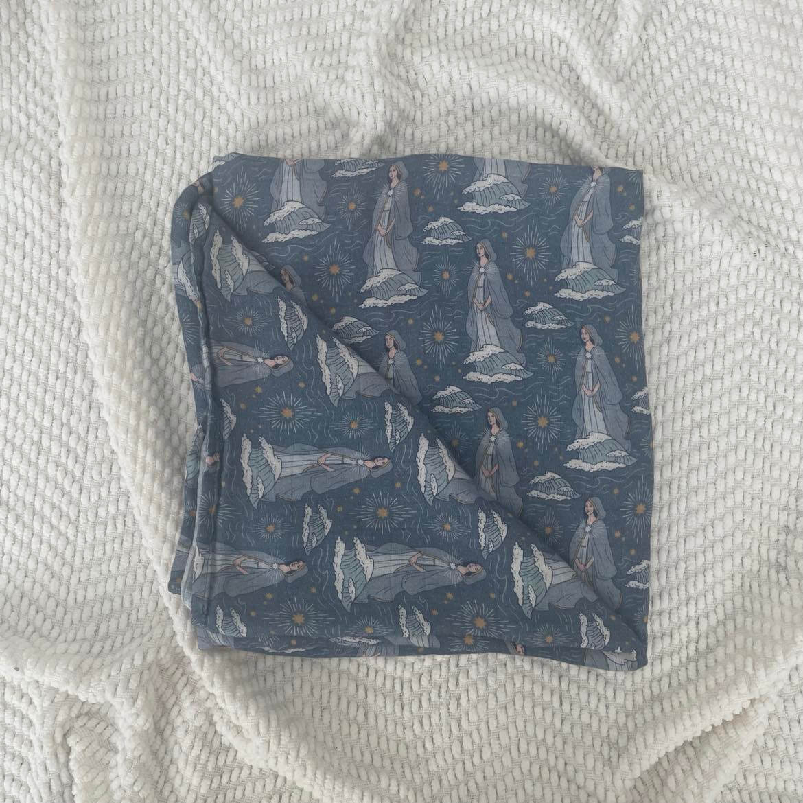 Stella Maris swaddle blanket in blue with religious pattern, made from 100% organic bamboo cotton, 47x47 inches.