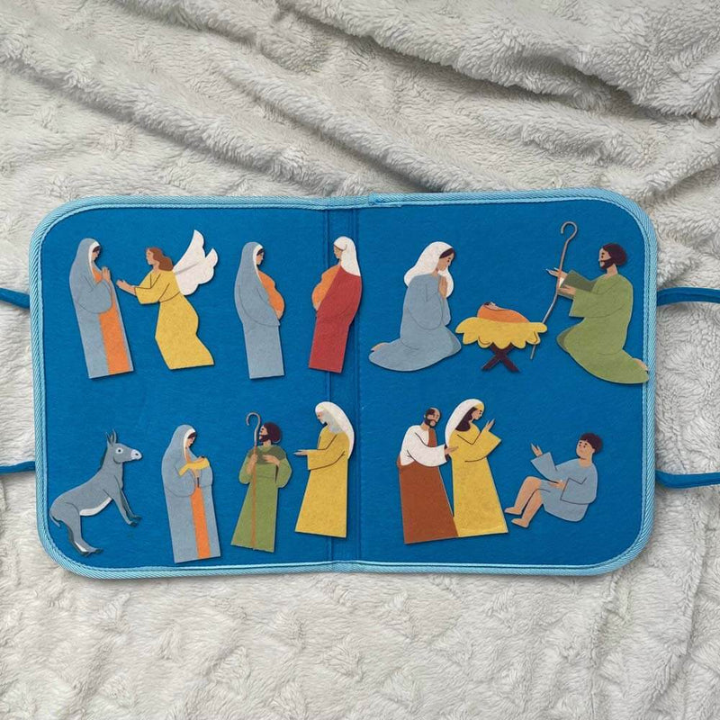 Catholic Mass Felt Book Kit with colorful figures depicting joyful mysteries for children's play and learning at church.
