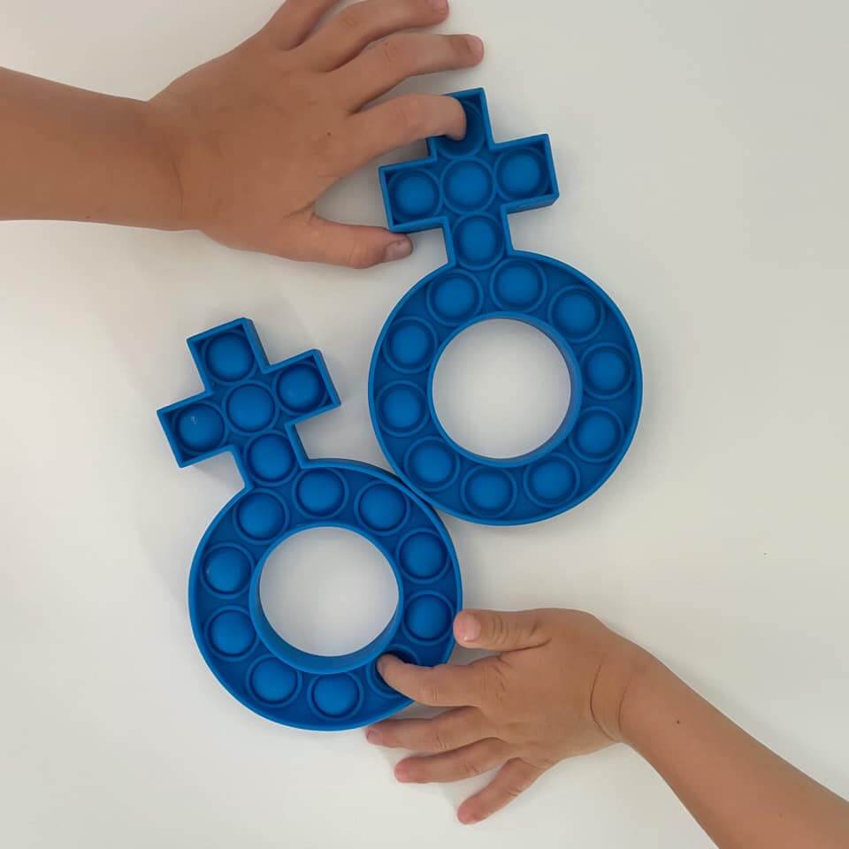 Children's hands playing with royal blue silicone Fidget Rosary Poppers in the shape of a rosary decade, stress relief toy.